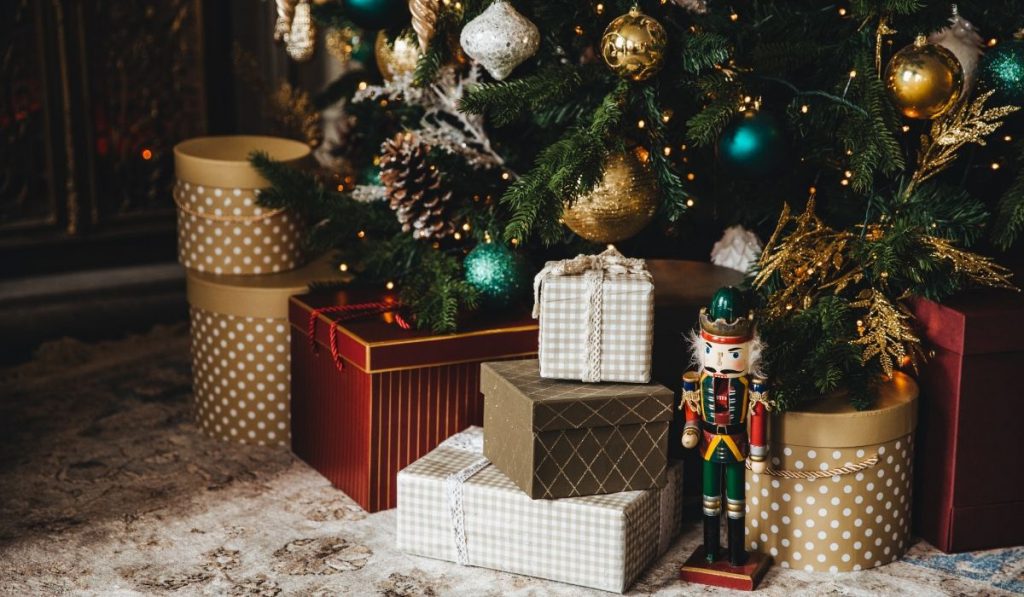 gift boxes red and gold beneath the christmas tree