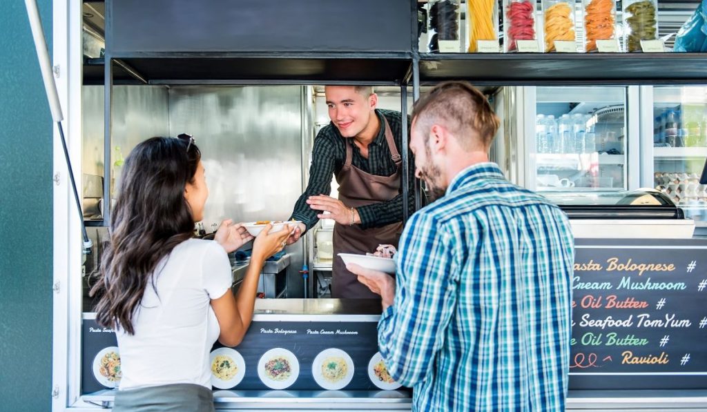 couples order and eat at the food truck