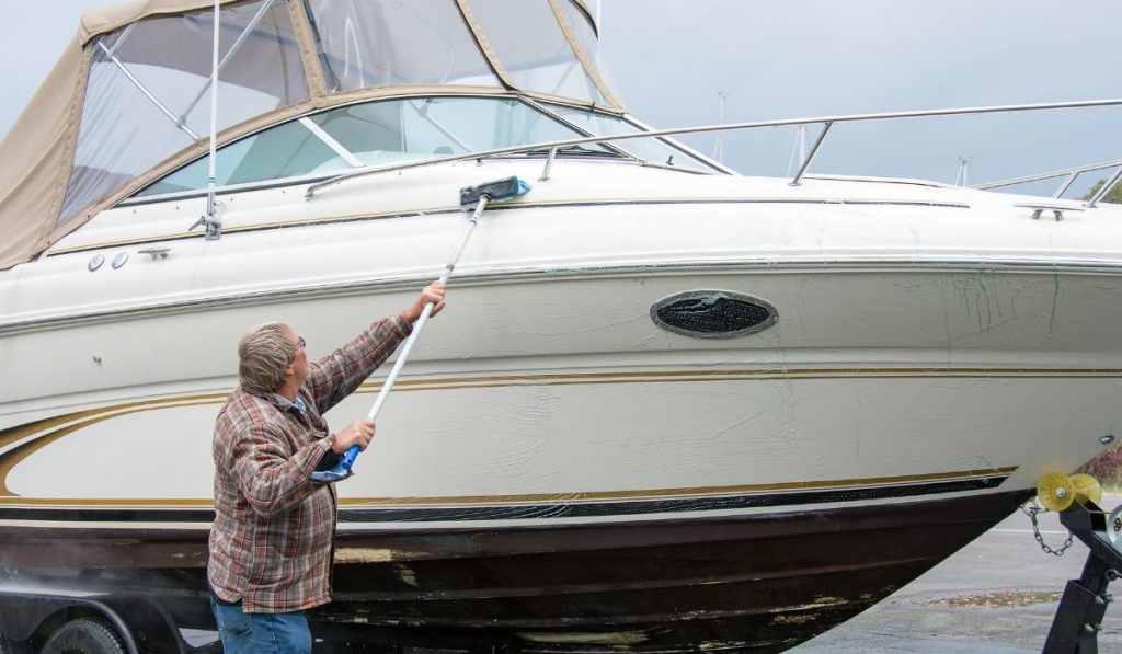 man cleaning his boat