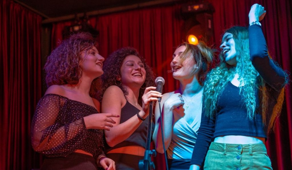 girls having a blast at a karaoke party